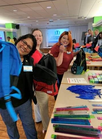 Ecolab Volunteers in Naperville fill backpacks for Kids in Need Foundation
