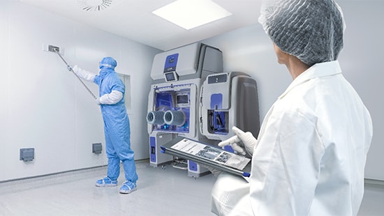 Technician cleaning a cleanroom with an Ecolab expert