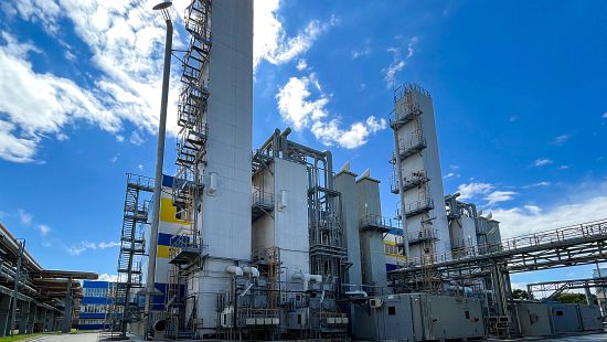 Production of oxygen and nitrogen from the air. The appearance of the distillation column and the main heat exchanger for air separation stock photo